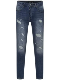 Jean troué en coton indigo uni avec une coupe skinny
