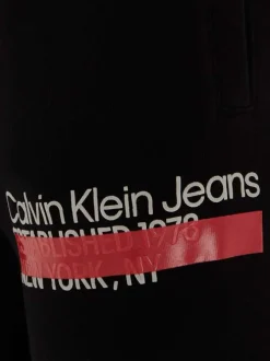 Jogging en coton noir uni avec nom de la marque inscrit sur la jambe gauche