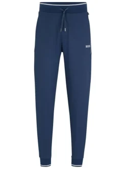 Jogging en coton mélangé bleu uni avec une coupe slim et un lien de serrage