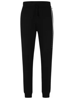 Jogging en coton noir uni avec une coupe droite et un lien de serrage