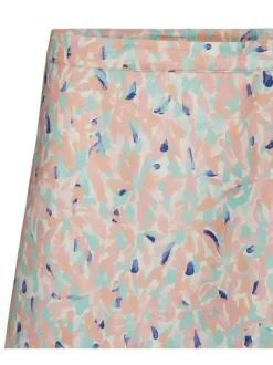 Jupe courte beige fantaisie avec une coupe slim et des boutons pour la fermeture