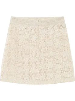 Jupe courte en coton écrue unie avec une coupe droite et un zip
