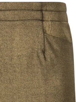 Jupe courte or à lurex avec une coupe droite et une taille élastiquée