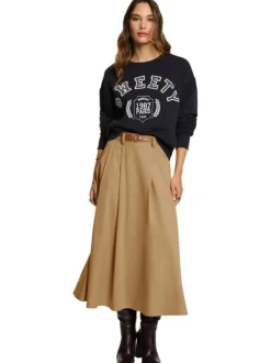 Jupe longue beige à plis pourvue d'une coupe évasée et d'une fermeture zippée