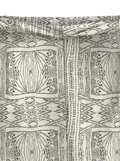 Jupe longue écrue droite à imprimé dessins all-over et boutonnée