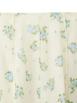 Jupe longue écrue à motifs pourvue d'une fermeture zippée et d'une coupe évasée