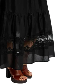 Jupe longue esprit bohème en coton noire unie pourvue d'une coupe évasée