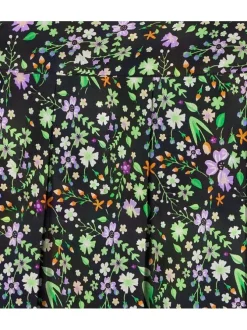Jupe noire courte et zippée imprimé floral avec une coupe patineuse