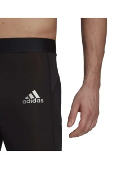 Legging noir coupe skinny avec taille élastiquée et logo floqué sur la cuisse gauche