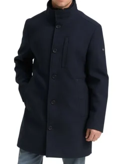 Manteau marine uni avec un col montant et boutonnière à l'avant