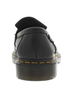 Mocassins noir à semelle à talon plat avec un pompon et des franges