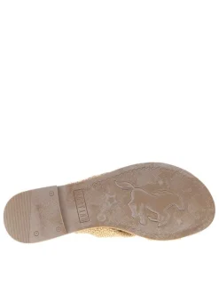 Mules beiges à semelle plate avec des brides croisées à l'avant