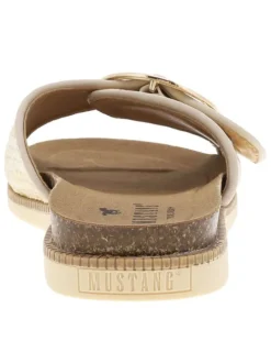 Mules dorées et blanches avec une boucle à ardillon sur le bout