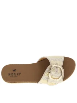 Mules dorées et blanches avec une boucle à ardillon sur le bout