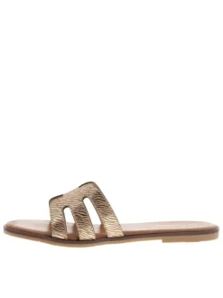 Mules en cuir beiges à semelle plate avec un effet zébré doré à l'avant