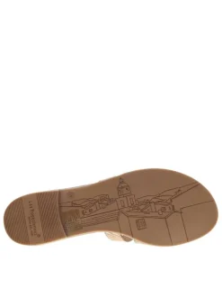 Mules en cuir beiges à semelle plate avec un effet zébré doré à l'avant