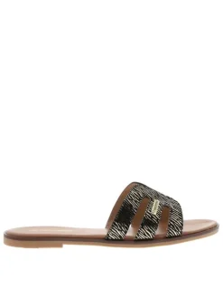 Mules en cuir noires à semelle plate avec un effet zébré doré à l'avant
