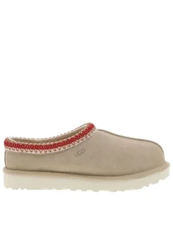 Mules en cuir sable avec un logo iconique embossé sur le côté