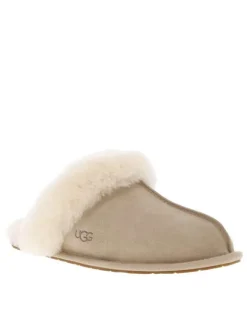 Mules en cuir taupe à talon plat pourvues de fausse fourrure
