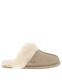 Mules en cuir taupe à talon plat pourvues de fausse fourrure