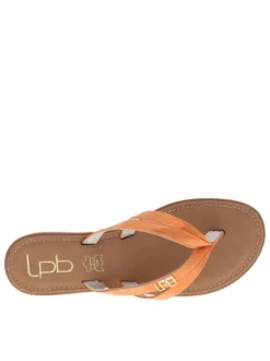 Mules Izel orange avec un logo métallique doré et un entre-doigt