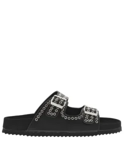 Mules noires à œillets métalliques et à boucles à ardillon sur le côté