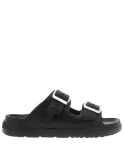 Mules noires à semelle plate et une fermeture à boucle à ardillon