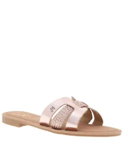 Mules roses métal avec un talon plat et un logo en pièce métallique