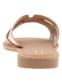 Mules roses métal avec un talon plat et un logo en pièce métallique