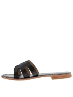 Mules à talon plat Damia noires en cuir avec bride unique sur la tige