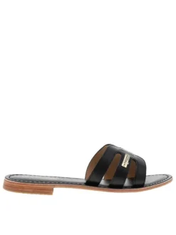 Mules à talon plat Damia noires en cuir avec bride unique sur la tige