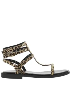 Nu-pieds en cuir léopard avec des clous dorés et à talon décroché bas