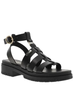 Nu-pieds en cuir noirs à semelle plat et à boucle à ardillon