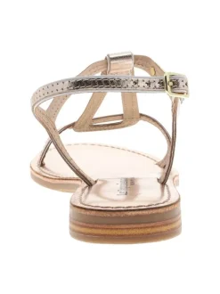 Nu-pieds en cuir or à semelle plat et une fermeture à boucle à ardillon