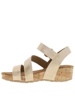 Nu-pieds or à semelle compensé et une fermeture à boucle à ardillon