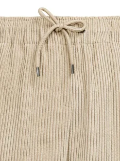 Pantalon beige clair en velours côtelé à coupe droite et taille élastiquée