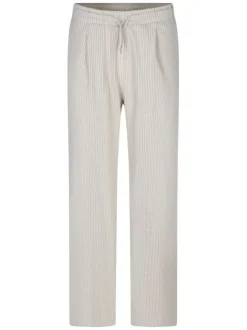 Pantalon beige coupe ample orné d'un motif à rayures verticales