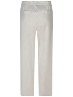 Pantalon beige coupe ample orné d'un motif à rayures verticales