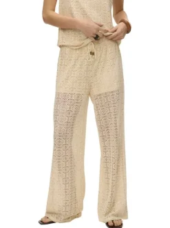 Pantalon beige en guipure coupe ample pourvu d'une taille élastiquée