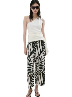 Pantalon beige à motifs pourvu d'une taille élastiquée et d'une coupe large