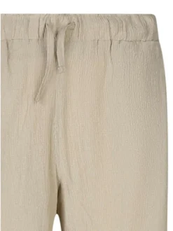 Pantalon beige pourvu d'une taille élastiquée avec cordon de serrage