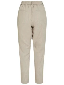 Pantalon beige uni avec une coupe cigarette et une taille intermédiaire