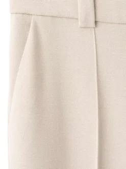 Pantalon beige uni avec une coupe droite et une taille mi-haute