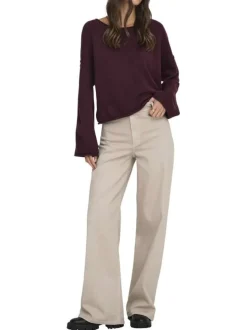 Pantalon beige uni avec une coupe flare avec un zip et un bouton