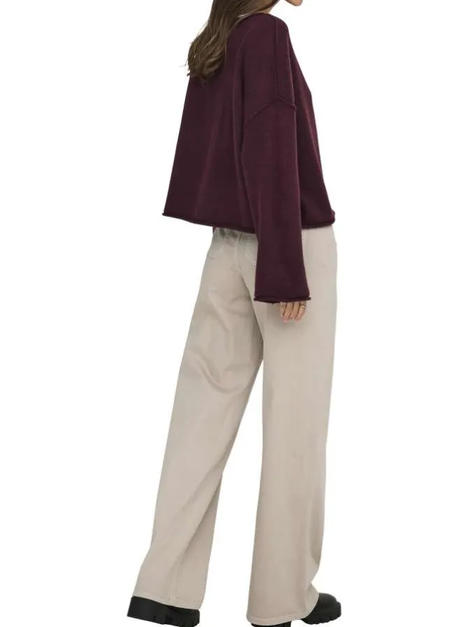 Pantalon beige uni avec une coupe flare avec un zip et un bouton