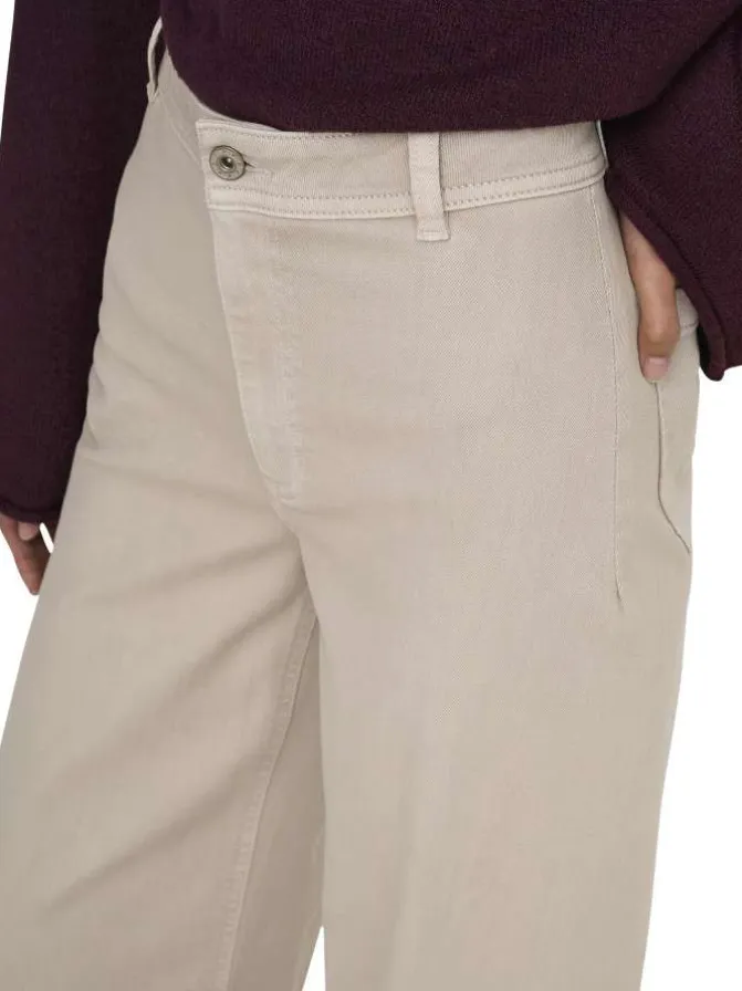 Pantalon beige uni avec une coupe flare avec un zip et un bouton