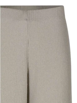 Pantalon beige uni pourvu d'une coupe large et d'une taille haute