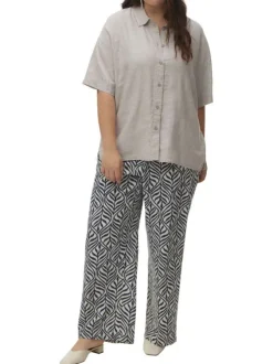 Pantalon blanc et bleu marine à motif tropical avec une coupe bootcut