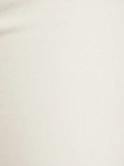Pantalon blanc uni avec une coupe slim et une taille intermédiaire