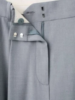 Pantalon bleu gris uni avec une coupe bootcut et une braguette zippée